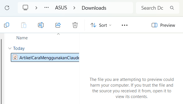Preview pane File Explorer menampilkan pesan penolakan untuk berkas PDF yang baru diunduh